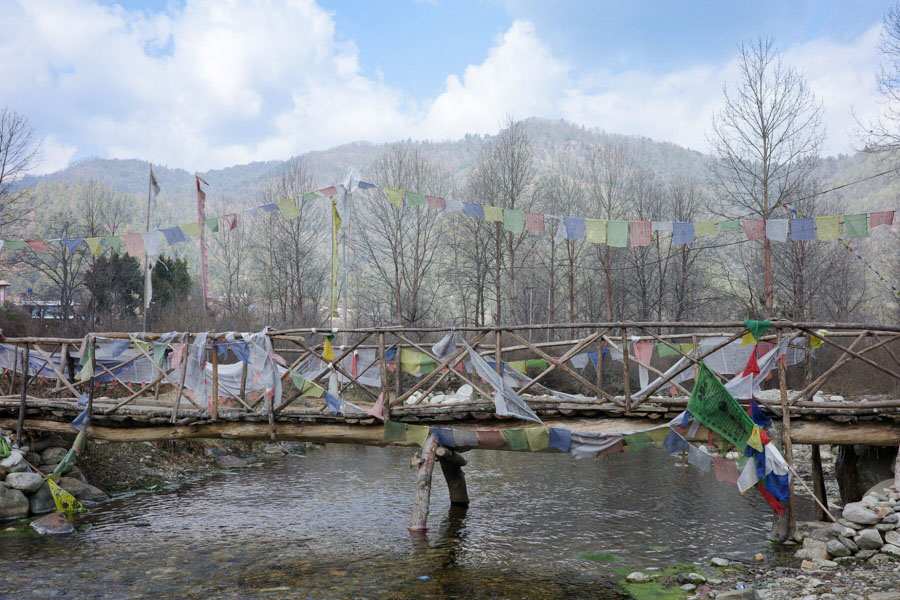 Trails, rivers and prayer-flag bridges near Jhamtse Gatsal